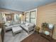 Screened-in front porch featuring comfortable seating and stylish decor for outdoor enjoyment at 805 Johnson Ave, Lakeland, FL 33801