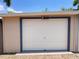 A clean, white garage door with contrasting trim adds curb appeal to the property at 805 Johnson Ave, Lakeland, FL 33801