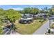 Aerial view of a charming two-story home with wraparound porch on a large lot at 822 W Patterson St, Lakeland, FL 33803