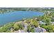 Aerial view of a charming home with mature trees and a nearby lake at 822 W Patterson St, Lakeland, FL 33803
