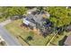 An aerial view shows a charming home with a large yard, and a fenced-in area at 822 W Patterson St, Lakeland, FL 33803