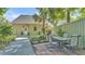 Charming home exterior features a patio set on brick pavers and a cozy outdoor dining space at 822 W Patterson St, Lakeland, FL 33803