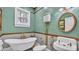 This bathroom features a claw foot tub, vintage sink, toilet and beautiful gold fixtures at 822 W Patterson St, Lakeland, FL 33803