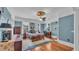 Bedroom with ceiling fan, hardwood floors, and natural light at 822 W Patterson St, Lakeland, FL 33803