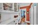 A butler's pantry features white cabinets, drawers, countertop, and an opening into another room at 822 W Patterson St, Lakeland, FL 33803