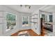 Bright closet with adjustable shelving, hardwood flooring and view into the main bedroom at 822 W Patterson St, Lakeland, FL 33803