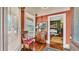 Cozy entryway featuring a vintage chair, hardwood floors, and natural light at 822 W Patterson St, Lakeland, FL 33803