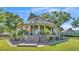 Beautiful home with a large, covered wrap-around porch and well-maintained front yard at 822 W Patterson St, Lakeland, FL 33803