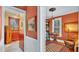 This hallway features a bathroom with vintage wood paneling and a cozy room with a chess table at 822 W Patterson St, Lakeland, FL 33803