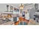 This kitchen features white cabinets, granite countertops, stainless steel appliances, and a stained glass window at 822 W Patterson St, Lakeland, FL 33803