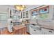 Bright kitchen featuring stainless steel appliances, granite counters, and farmhouse sink at 822 W Patterson St, Lakeland, FL 33803