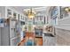 Well-lit kitchen with stainless steel appliances and custom cabinetry at 822 W Patterson St, Lakeland, FL 33803