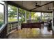 Relax on this charming porch swing with views of the lush yard and lake at 822 W Patterson St, Lakeland, FL 33803
