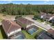 Aerial view of the homes in the neighborhood and a green pin on the roof at 8931 Sugar Palm Rd, Kissimmee, FL 34747