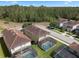 Aerial view of the homes in the neighborhood, each featuring a screened-in pool and backyard at 8931 Sugar Palm Rd, Kissimmee, FL 34747