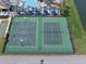 An aerial view of the community basketball and tennis courts near the pool at 8931 Sugar Palm Rd, Kissimmee, FL 34747