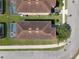 Birds eye aerial view of the home with a screened-in pool and roof at 8931 Sugar Palm Rd, Kissimmee, FL 34747