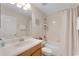 Clean bathroom with a single sink vanity, shower-tub combo with white tiling, and ample space at 8931 Sugar Palm Rd, Kissimmee, FL 34747
