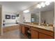 Well-lit primary bathroom with soaking tub, double vanity, and glass-enclosed shower at 8931 Sugar Palm Rd, Kissimmee, FL 34747
