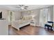 Cozy bedroom featuring hardwood floors, natural light, and stylish decor at 8931 Sugar Palm Rd, Kissimmee, FL 34747