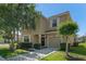 Charming two-story home features a neutral facade, well-manicured landscaping, and a cozy front porch at 8931 Sugar Palm Rd, Kissimmee, FL 34747