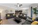 Open floor plan showcases the living room flowing into the kitchen, with dark cabinetry at 8931 Sugar Palm Rd, Kissimmee, FL 34747