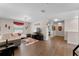 Open layout with entertainment area, white walls, and resilient wood-look flooring at 8931 Sugar Palm Rd, Kissimmee, FL 34747