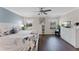 Inviting primary suite featuring wood-look floors, a butterfly wall art, and ample natural light at 8931 Sugar Palm Rd, Kissimmee, FL 34747