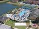 The community's resort-style pool features lounge seating, water features, and palm trees, perfect for relaxation and recreation at 8931 Sugar Palm Rd, Kissimmee, FL 34747
