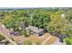 This home boasts an aerial view surrounded by mature trees and lush landscaping at 919 S Missouri Ave, Lakeland, FL 33803