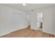 This bedroom boasts hardwood floors, a closet with sliding doors, and an attached bathroom at 919 S Missouri Ave, Lakeland, FL 33803