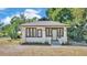 Charming single-story home featuring a gray roof and a welcoming front entry framed with new landscaping at 919 S Missouri Ave, Lakeland, FL 33803