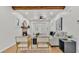 Bright living room featuring a comfortable sofa, modern ceiling fan, and wooden beam accents at 919 S Missouri Ave, Lakeland, FL 33803