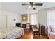 Bedroom with hardwood floors, fireplace, and lots of natural light at 934 Lake Elbert Se Dr, Winter Haven, FL 33880