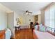Large bedroom with hardwood floors, windows for natural light and doorway to connecting rooms at 934 Lake Elbert Se Dr, Winter Haven, FL 33880