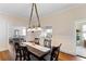 Bright dining room with hardwood floors, neutral walls and view into other rooms at 934 Lake Elbert Se Dr, Winter Haven, FL 33880
