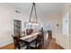 Dining room with hardwood floors offering easy access to living spaces and stairs at 934 Lake Elbert Se Dr, Winter Haven, FL 33880