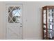Entryway with glass paneled door and display cabinet at 934 Lake Elbert Se Dr, Winter Haven, FL 33880