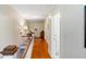 Upstairs hallway with hardwood floors, white walls and staircase at 934 Lake Elbert Se Dr, Winter Haven, FL 33880