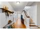 Inviting hallway with hardwood floors, staircase, and natural light at 934 Lake Elbert Se Dr, Winter Haven, FL 33880
