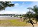 Scenic lake view from the property, featuring a road and lush tropical foliage at 934 Lake Elbert Se Dr, Winter Haven, FL 33880