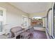 Cozy outdoor patio featuring comfortable wicker furniture and a view of the neighborhood at 934 Lake Elbert Se Dr, Winter Haven, FL 33880