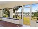 Covered porch with lake views at 934 Lake Elbert Se Dr, Winter Haven, FL 33880