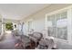 Inviting porch with wicker furniture and classic architectural details, perfect for outdoor relaxation at 934 Lake Elbert Se Dr, Winter Haven, FL 33880