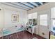 Bright sunroom with tile flooring, charming decor, and ample natural light, ideal for relaxation at 934 Lake Elbert Se Dr, Winter Haven, FL 33880