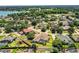 Scenic aerial view of a lakefront neighborhood featuring well-maintained lawns and tree-lined streets at 942 Hanover Way, Lakeland, FL 33813