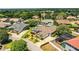 An expansive aerial perspective shows a neighborhood with beautiful landscaping and backyard pools at 942 Hanover Way, Lakeland, FL 33813