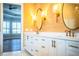 Bathroom with double sinks, custom mirrors, and granite counters at 942 Hanover Way, Lakeland, FL 33813