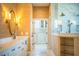 Beautiful bathroom featuring dual sinks, walk-in shower, and a spacious closet at 942 Hanover Way, Lakeland, FL 33813