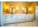 Bathroom with double sinks, custom mirrors, and great lighting at 942 Hanover Way, Lakeland, FL 33813